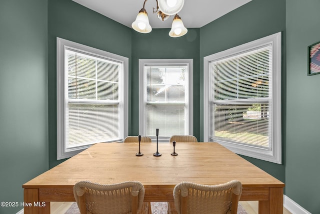 211 Bill Canady Rd, Sneads Ferry, NC 28460 - dining space with a chandelier and baseboards