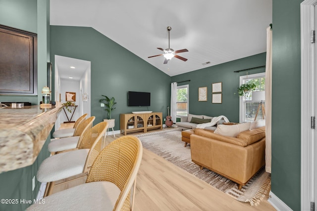 211 Bill Canady Rd, Sneads Ferry, NC 28460 - living area with wood finished floors, ceiling fan, baseboards, and high vaulted ceiling