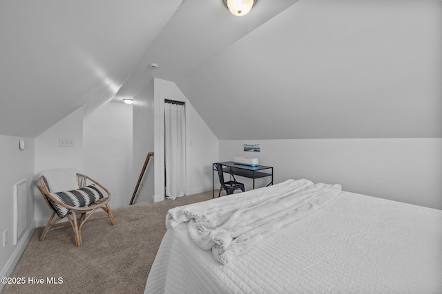 211 Bill Canady Rd, Sneads Ferry, NC 28460 - carpeted bedroom featuring vaulted ceiling and baseboards