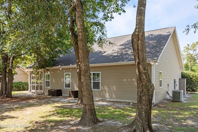 211 Bill Canady Rd, Sneads Ferry, NC 28460 - back of property with a shingled roof and central AC