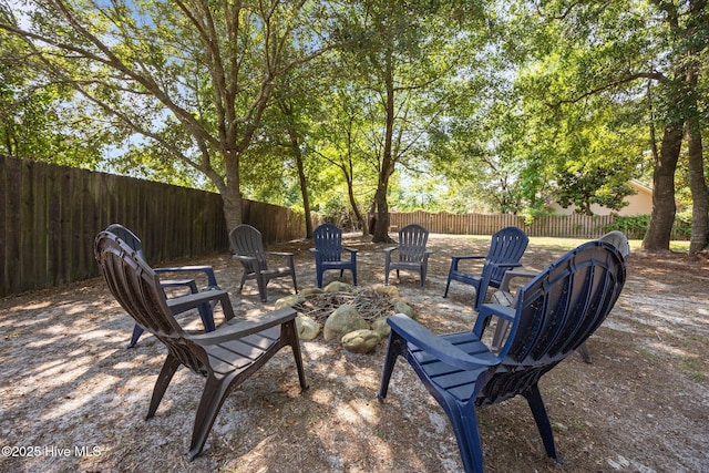 211 Bill Canady Rd, Sneads Ferry, NC 28460 - fenced backyard featuring an outdoor fire pit