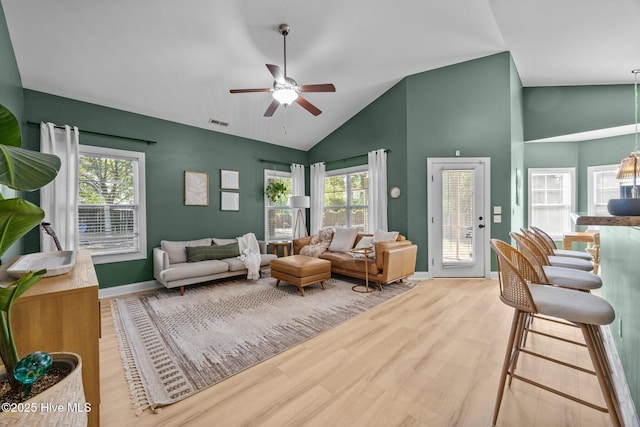 211 Bill Canady Rd, Sneads Ferry, NC 28460 - living room featuring ceiling fan, wood finished floors, high vaulted ceiling, healthy amount of natural light, and baseboards