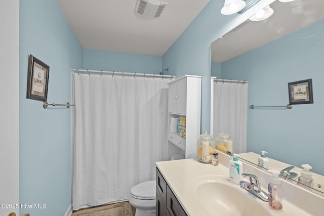 531 S NC Highway 343, Camden, NC 27921 - bathroom featuring toilet, vanity, and curtained shower
