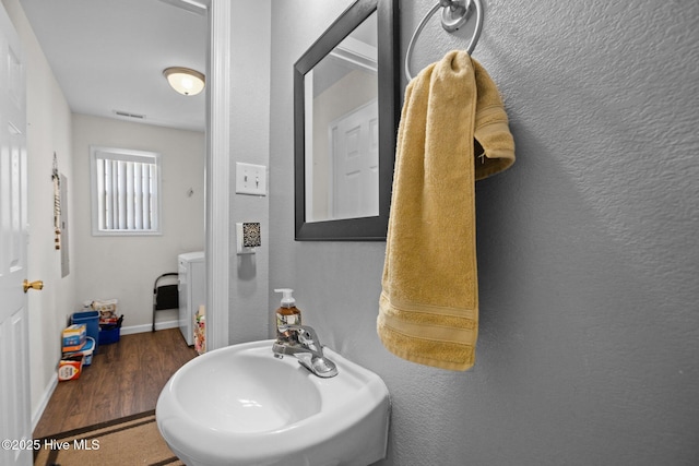 531 S NC Highway 343, Camden, NC 27921 - bathroom with a sink, wood finished floors, and baseboards
