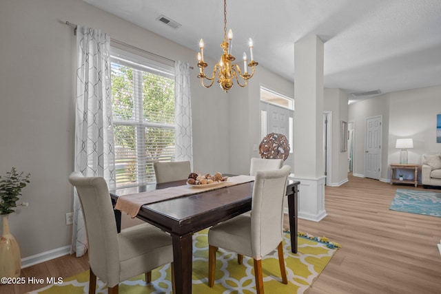 1424 Elgin St, Wilmington, NC 28409 - dining area with a chandelier and light wood-style flooring