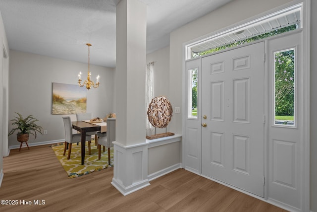 1424 Elgin St, Wilmington, NC 28409 - entryway with light wood-type flooring and a chandelier