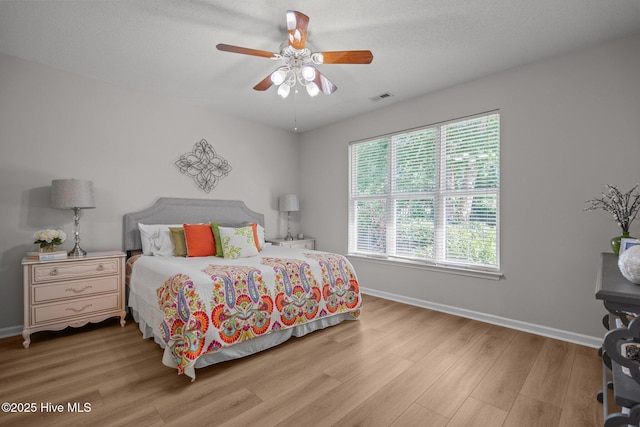 1424 Elgin St, Wilmington, NC 28409 - bedroom featuring wood finished floors, multiple windows, and a ceiling fan