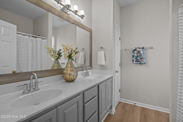1424 Elgin St, Wilmington, NC 28409 - full bathroom featuring double vanity and wood finished floors
