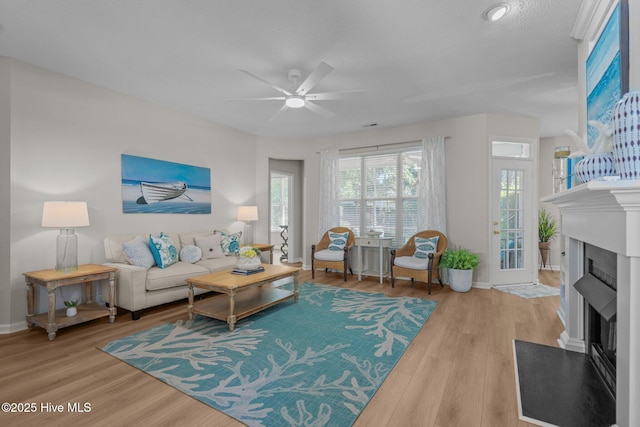 1424 Elgin St, Wilmington, NC 28409 - living room featuring ceiling fan, a fireplace with flush hearth, and wood finished floors
