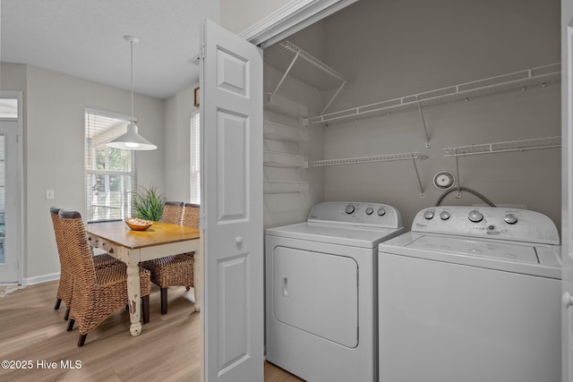 1424 Elgin St, Wilmington, NC 28409 - laundry room with light wood-style flooring and washing machine and dryer