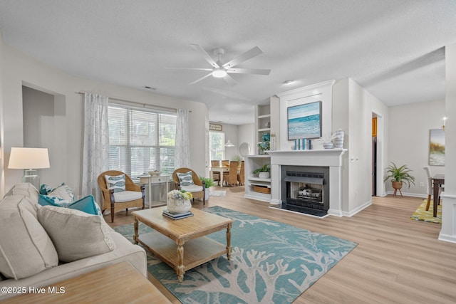 1424 Elgin St, Wilmington, NC 28409 - living area featuring ceiling fan, light wood-style flooring, and a textured ceiling