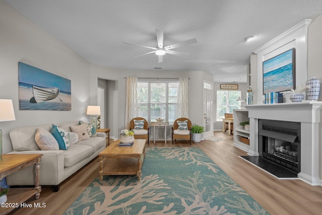 1424 Elgin St, Wilmington, NC 28409 - living area featuring ceiling fan, wood finished floors, and a fireplace with raised hearth