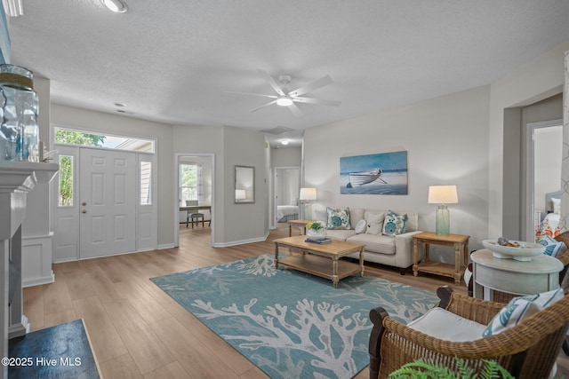 1424 Elgin St, Wilmington, NC 28409 - living room featuring wood finished floors, ceiling fan, and a textured ceiling