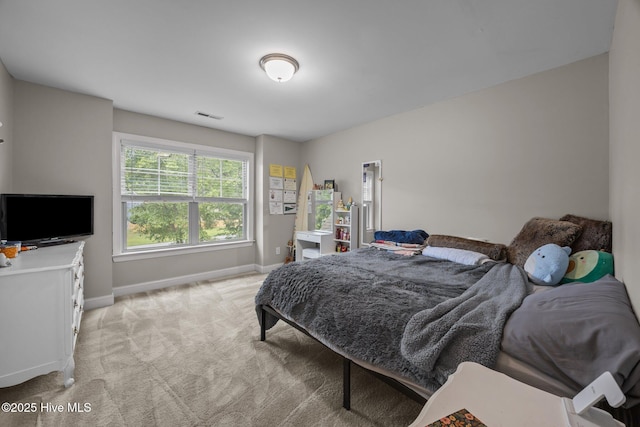 285 Mimosa Dr, Sneads Ferry, NC 28460 - bedroom featuring baseboards and light carpet