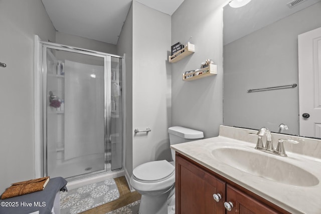 285 Mimosa Dr, Sneads Ferry, NC 28460 - bathroom featuring a stall shower, vanity, toilet, and tile patterned floors