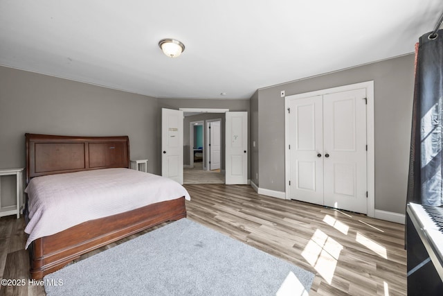 285 Mimosa Dr, Sneads Ferry, NC 28460 - bedroom featuring a closet, wood finished floors, and baseboards