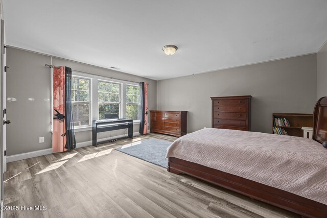 285 Mimosa Dr, Sneads Ferry, NC 28460 - bedroom featuring wood finished floors and baseboards