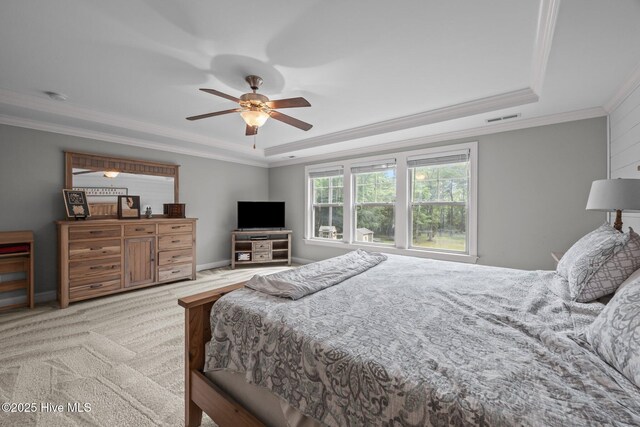 285 Mimosa Dr, Sneads Ferry, NC 28460 - carpeted bedroom featuring a raised ceiling, ornamental molding, a ceiling fan, and baseboards