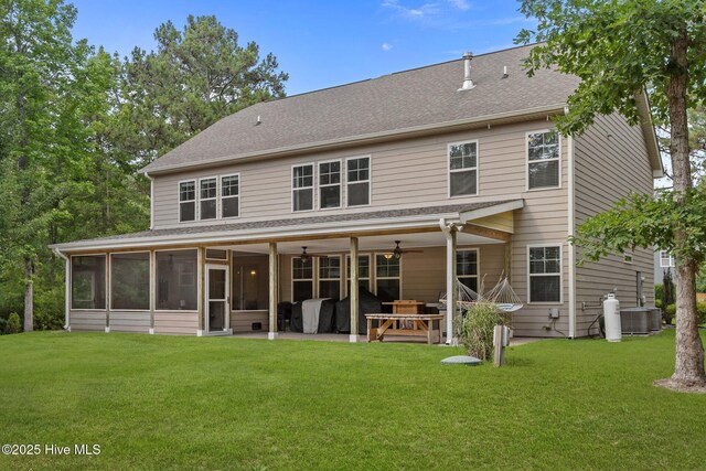 285 Mimosa Dr, Sneads Ferry, NC 28460 - back of house featuring a patio area, a ceiling fan, a yard, a sunroom, and central AC unit