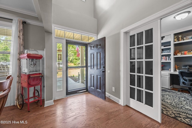 285 Mimosa Dr, Sneads Ferry, NC 28460 - entrance foyer with wood finished floors, crown molding, and baseboards