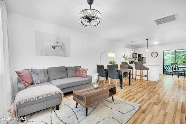 522 S Kerr Ave Unit 66, Wilmington, NC 28403 - living area with light wood finished floors and a chandelier