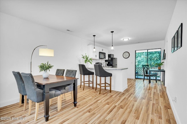 522 S Kerr Ave Unit 66, Wilmington, NC 28403 - dining area with light wood finished floors and baseboards