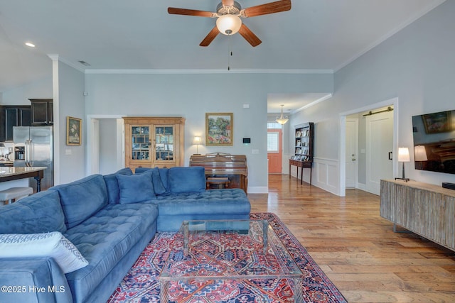 6122 Chancellorsville Dr, Wilmington, NC 28409 - living area featuring ceiling fan, light wood-style flooring, and ornamental molding