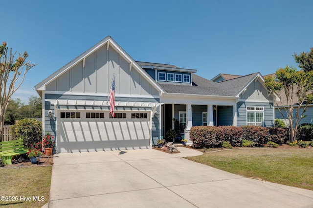 6122 Chancellorsville Dr, Wilmington, NC 28409 - craftsman inspired home with board and batten siding, an attached garage, driveway, a front lawn, and roof with shingles