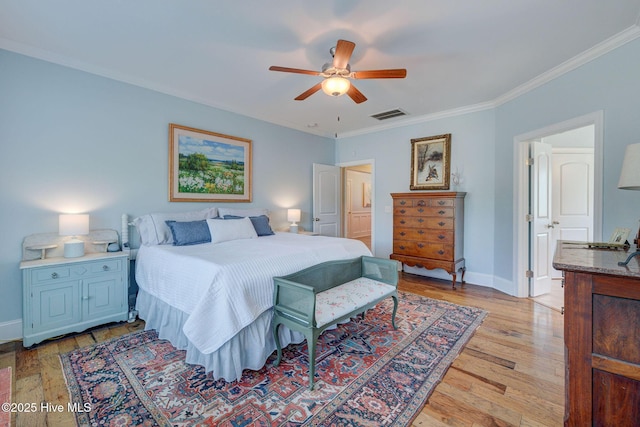 6122 Chancellorsville Dr, Wilmington, NC 28409 - bedroom featuring ornamental molding, light wood-type flooring, baseboards, and a ceiling fan