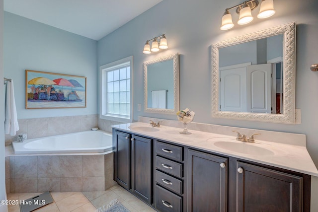 6122 Chancellorsville Dr, Wilmington, NC 28409 - bathroom featuring tile patterned flooring, double vanity, and a bath
