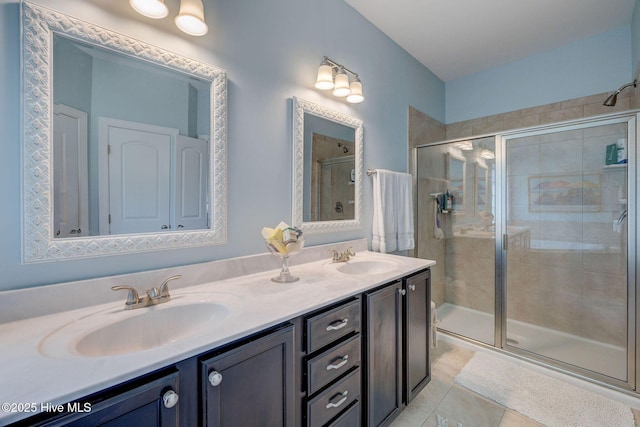 6122 Chancellorsville Dr, Wilmington, NC 28409 - full bathroom featuring a shower stall, double vanity, and tile patterned flooring