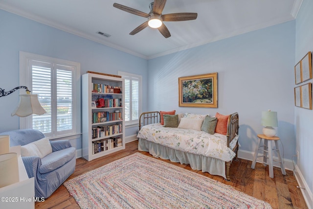 6122 Chancellorsville Dr, Wilmington, NC 28409 - bedroom with crown molding, baseboards, wood finished floors, and a ceiling fan