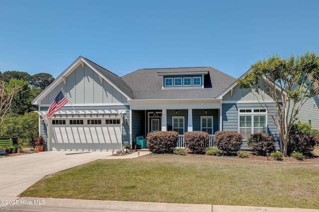6122 Chancellorsville Dr, Wilmington, NC 28409 - craftsman inspired home with board and batten siding, a front lawn, an attached garage, and concrete driveway