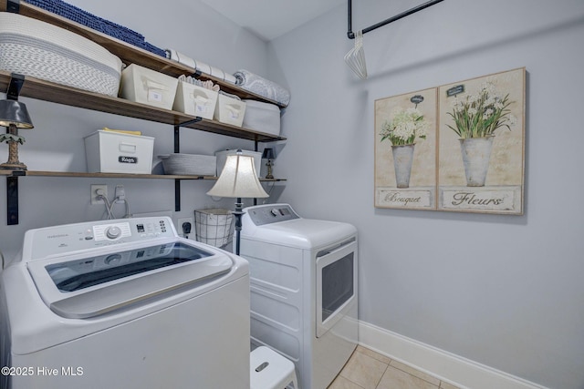 6122 Chancellorsville Dr, Wilmington, NC 28409 - laundry room featuring washing machine and dryer, tile patterned floors, and baseboards