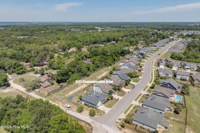 6122 Chancellorsville Dr, Wilmington, NC 28409 - aerial perspective of suburban area with a heavily wooded area