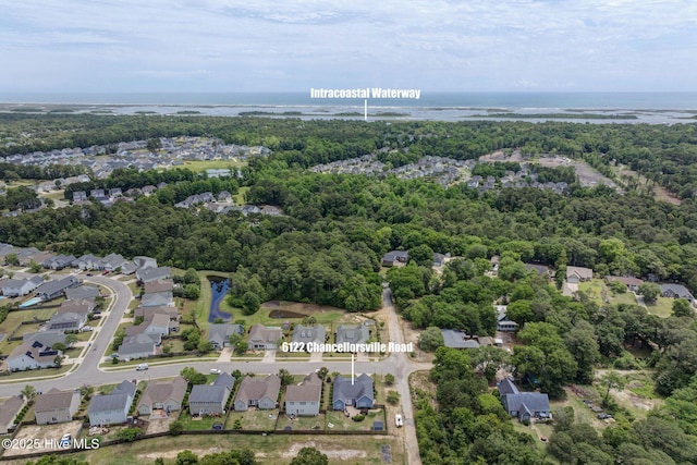 6122 Chancellorsville Dr, Wilmington, NC 28409 - aerial view of property's location with a large body of water, nearby suburban area, and a heavily wooded area