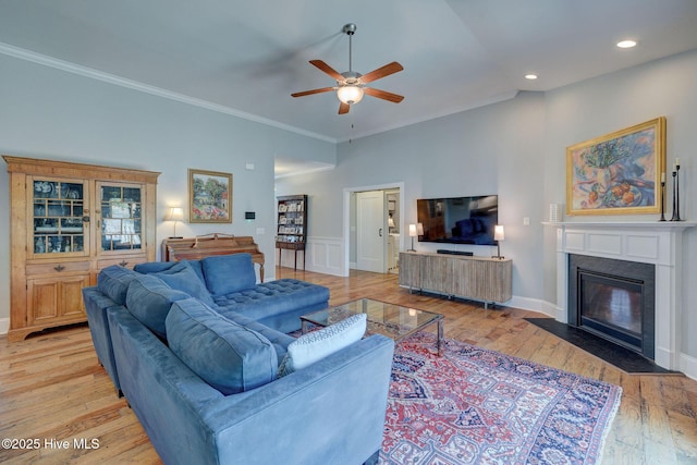 6122 Chancellorsville Dr, Wilmington, NC 28409 - living room with ceiling fan, crown molding, light wood-type flooring, a fireplace with flush hearth, and recessed lighting