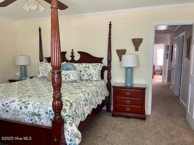 2008 Hardee Rd, Kinston, NC 28504 - bedroom with ornamental molding, carpet floors, a ceiling fan, and attic access