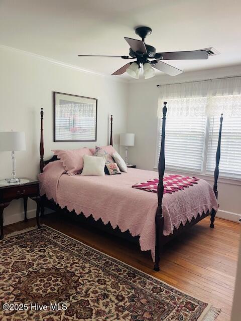 2008 Hardee Rd, Kinston, NC 28504 - bedroom featuring light wood-style flooring, ceiling fan, and ornamental molding