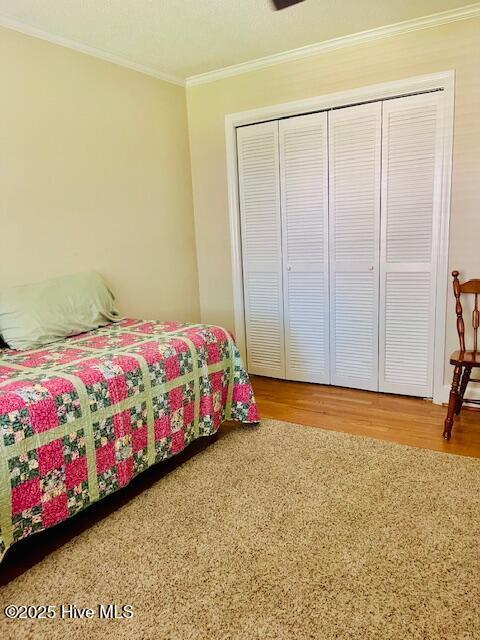 2008 Hardee Rd, Kinston, NC 28504 - bedroom with wood finished floors, ornamental molding, and a closet