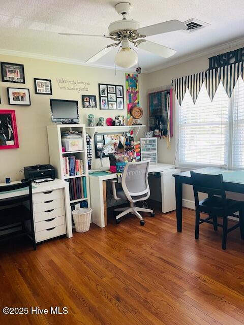 2008 Hardee Rd, Kinston, NC 28504 - office area with crown molding, ceiling fan, and wood finished floors