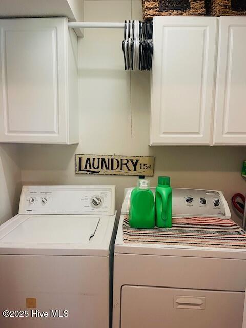 2008 Hardee Rd, Kinston, NC 28504 - laundry area featuring washing machine and dryer and cabinet space