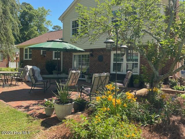 2008 Hardee Rd, Kinston, NC 28504 - back of house featuring brick siding and a patio