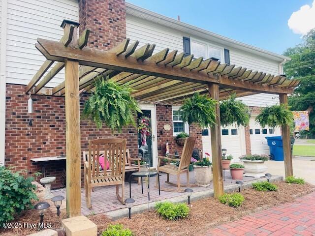 2008 Hardee Rd, Kinston, NC 28504 - view of patio / terrace featuring a pergola and a garage