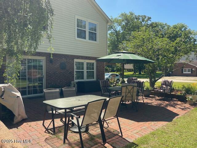 2008 Hardee Rd, Kinston, NC 28504 - view of patio featuring outdoor dining space