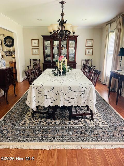 2008 Hardee Rd, Kinston, NC 28504 - dining space featuring a chandelier, wood finished floors, and crown molding