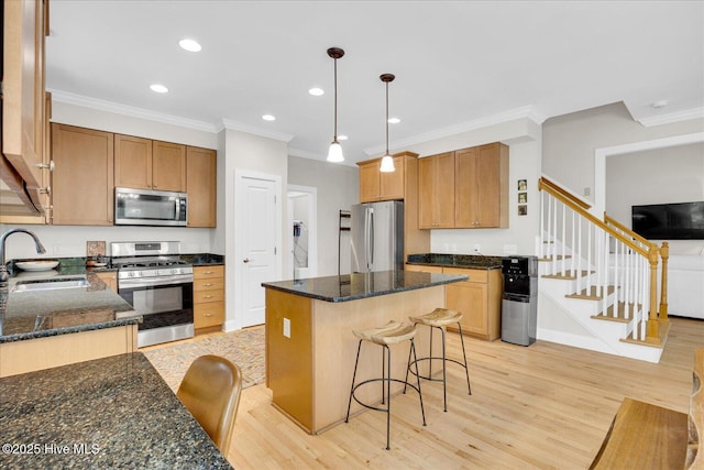 10196 Flint Ct SE, Leland, NC 28451 - kitchen with appliances with stainless steel finishes, a sink, crown molding, light wood-style flooring, and recessed lighting