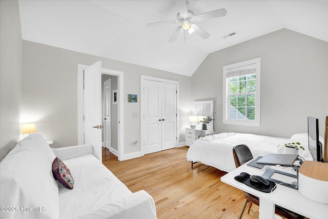 10196 Flint Ct SE, Leland, NC 28451 - bedroom with light wood-style floors, lofted ceiling, ceiling fan, a closet, and baseboards