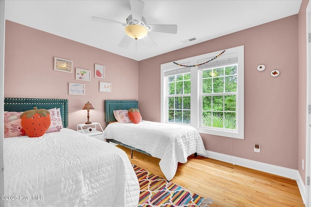 10196 Flint Ct SE, Leland, NC 28451 - bedroom featuring baseboards, light wood-style flooring, and a ceiling fan