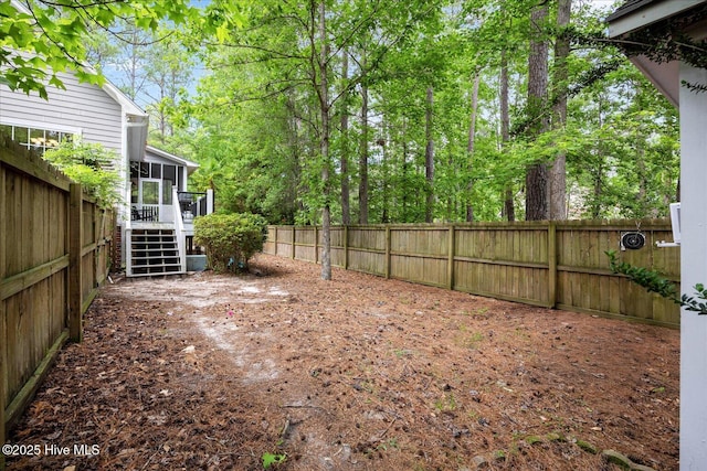 10196 Flint Ct SE, Leland, NC 28451 - fenced backyard with a sunroom and stairs